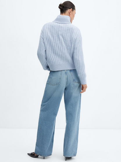 Rolled neck cable sweater